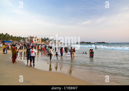 Horizontal view of people relaxing on Hawa or Eve's beach in the evening sun in Kovalam. Stock Photo
