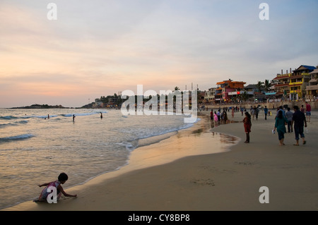 Horizontal view across Lighthouse beach at sunset in Kovalam, India. Stock Photo