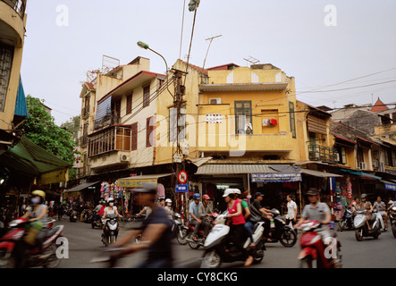 Chaotic street life traffic in the Old City of Hanoi in Vietnam in Far East Southeast Asia. Scene Transport People Lifestyle Quarter Town Travel Stock Photo