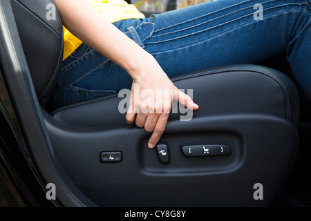 Electric seat adjustment of car Stock Photo