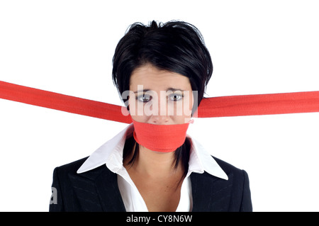 Business woman with her mouth tied up with red tape isolated on a white background Stock Photo