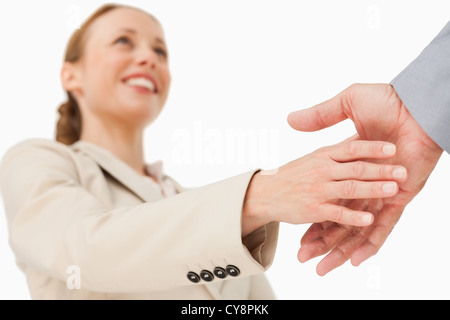 Low angle-shot of a woman shaking hands Stock Photo