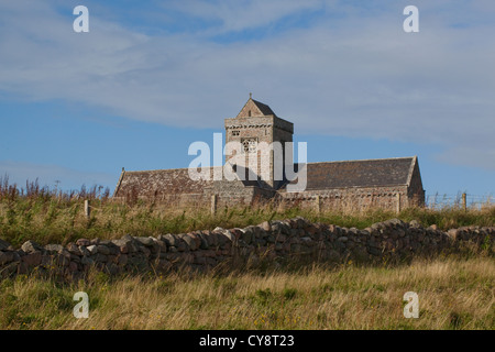 The Abbey. Iona. Inner Hebrides. West coast of Scotland. West side. Note stone wall retaining precincts on higher ground. Stock Photo