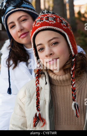 Preteen girl and friend wearing knit hats, portrait Stock Photo