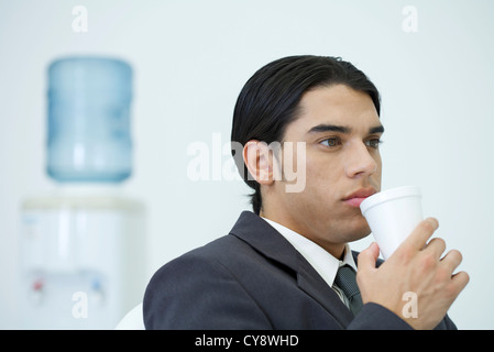 Young businessman taking a coffee break Stock Photo