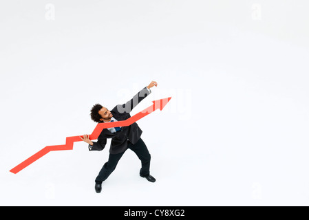 Businessman throwing arrow upward Stock Photo