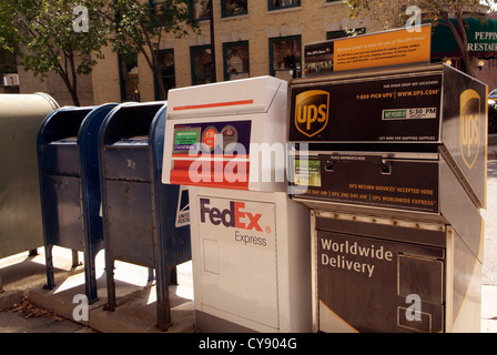 USA MADISON WISCONSIN US Mail, UPS, and Federal Express (FedEx) post boxes on the sidewalk. Stock Photo