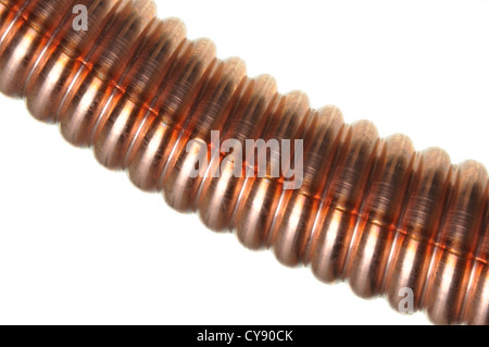 Corrugated copper tube on an isolated background Stock Photo
