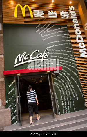A Chinese customer enters McDonald's McCafe in Shanghai, China Stock Photo