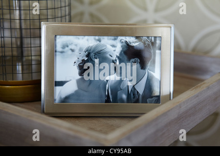 Framed Wedding photo of Bride and Groom kissing. Stock Photo