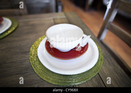 Place setting, dishes on wooden table Stock Photo
