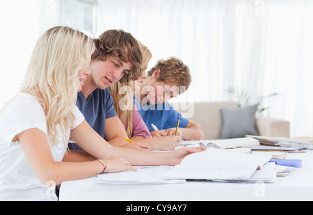 Students studying together at the table Stock Photo
