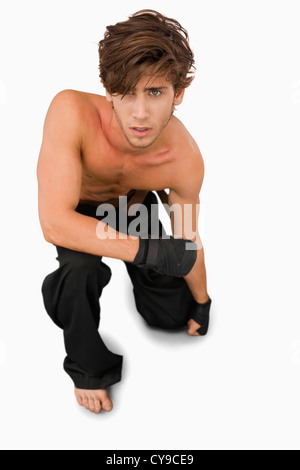 Martial arts fighter on his knees Stock Photo