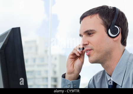Office worker using a headset Stock Photo
