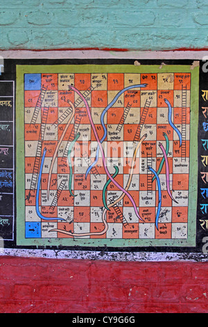 Snakes and ladders numbers game painted on a wall Stock Photo