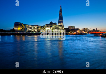 The Shard, City Hall and contemporary London city skyline, lit at dusk, River Thames, Southwark, SouthBank, London, England, UK. Stock Photo