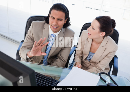 Focused business team using a computer Stock Photo