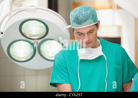 Surgeon standing in operating room Stock Photo - Alamy