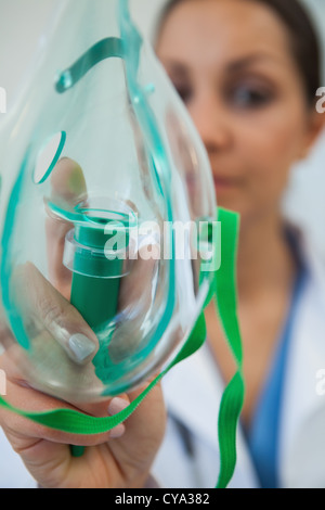 The doctor is holding an oxygen mask Stock Photo - Alamy