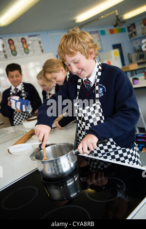 Pupils in a cookery class home economics food technology secondary comprehensive school , Wales UK Stock Photo