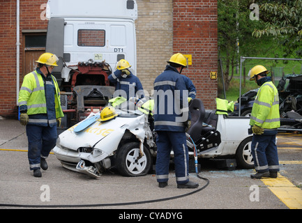 Fireman of white watch at Pontypridd Fire Station in S Wales - A training session using cutting equipment in the event of a road Stock Photo