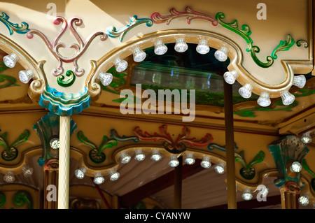 Amusement park details. Glowing lights and various ornaments. Stock Photo