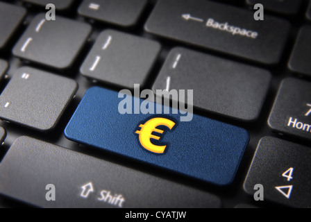 Make money with internet concept: blue key with golden euro sign on laptop keyboard. Included clipping path, so you can easily edit it. Stock Photo