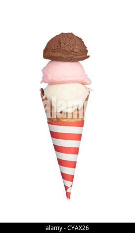 A waffle ice cream cone with chocolate, strawberry and vanilla ice cream with a red and white striped holder. Stock Photo