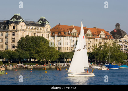 europe, switzerland, zurich, lake of zurich, historical building and sailing boat Stock Photo