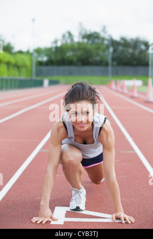 Woman starting to run Stock Photo