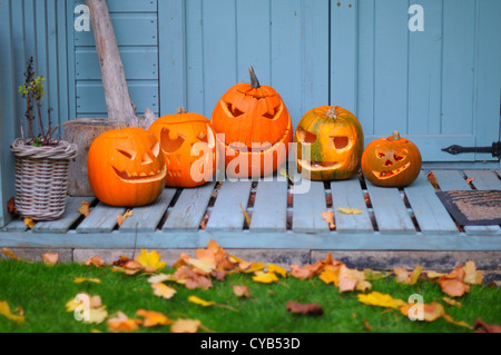 Carved pumpkins outside a summer house in England. Stock Photo
