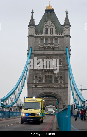 Ambulance with blue lights on going over Tower Bridge London-UK Stock Photo