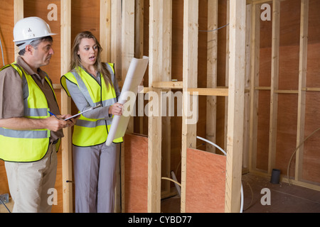 Architects studying the plan Stock Photo