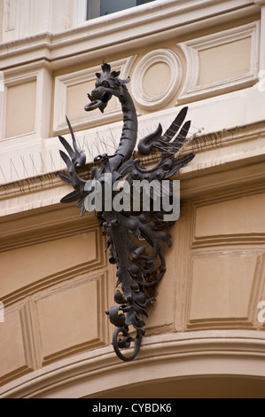 A wrought iron sculpture in the form of a dragon above a residential doorway, Cologne, Köln, Nordrhein-Westfalen, Germany Stock Photo