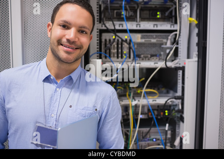 Man smiling in front of the servers Stock Photo