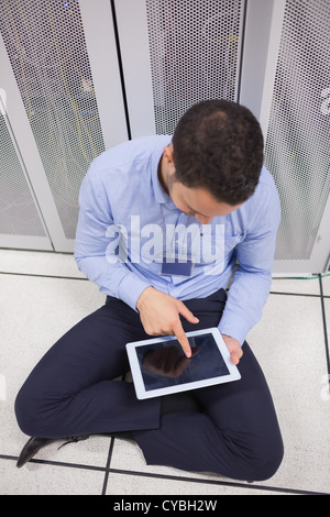 Man using tablet pc in data center Stock Photo