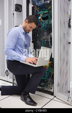 Concentrated technician doing data storage Stock Photo