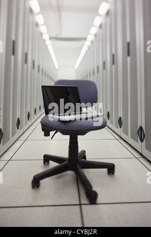 Laptop on a chair in hallway Stock Photo