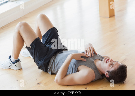 Man lying on the floor Stock Photo