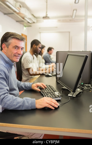 Cheerful man using the computer Stock Photo
