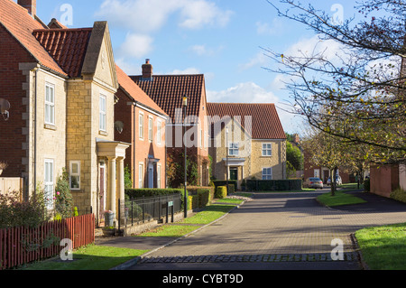 A typical British modern residential housing estate development and street, England, UK - Duchy of Cornwall development Stock Photo
