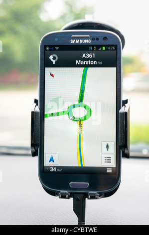 Google maps gps sat nav on a smartphone inside a car Stock Photo