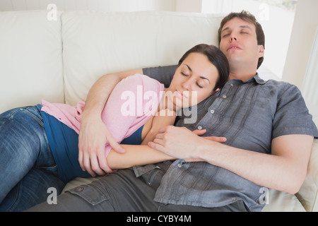 Young couple sleeping on the couch Stock Photo