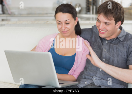 Two people using the laptop Stock Photo