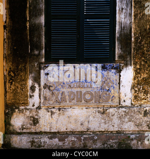 Ancient sign in Hoi An in Vietnam in Far East Southeast Asia. Texture Building Architecture History Historical Vietnamese Surface Palimpsest Travel Stock Photo