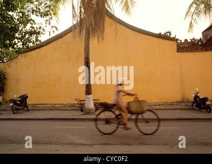 Cycling in Hoi An in Vietnam in Far East Southeast Asia. City Serene Serenity Cycle Bicycle Beautiful Tranquil Wanderlust Escapism Travel Stock Photo