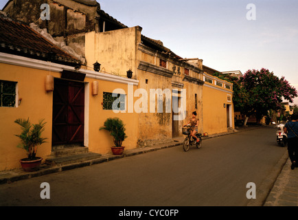 Buildings of Hoi An in Vietnam in Far East Southeast Asia. Architecture Building Street Scene Culture History Sunset Dusk Wanderlust Escapism Travel Stock Photo