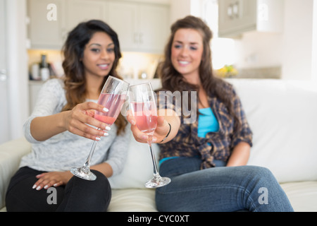 Friends clinking glasses of champagne Stock Photo