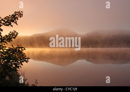 UK Scotland Inverness-shire Loch Garry Early morning autumn mist and mountain of Ben Tee Stock Photo