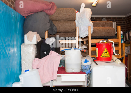 Suburban garage used as storage full of household items and mess Stock Photo